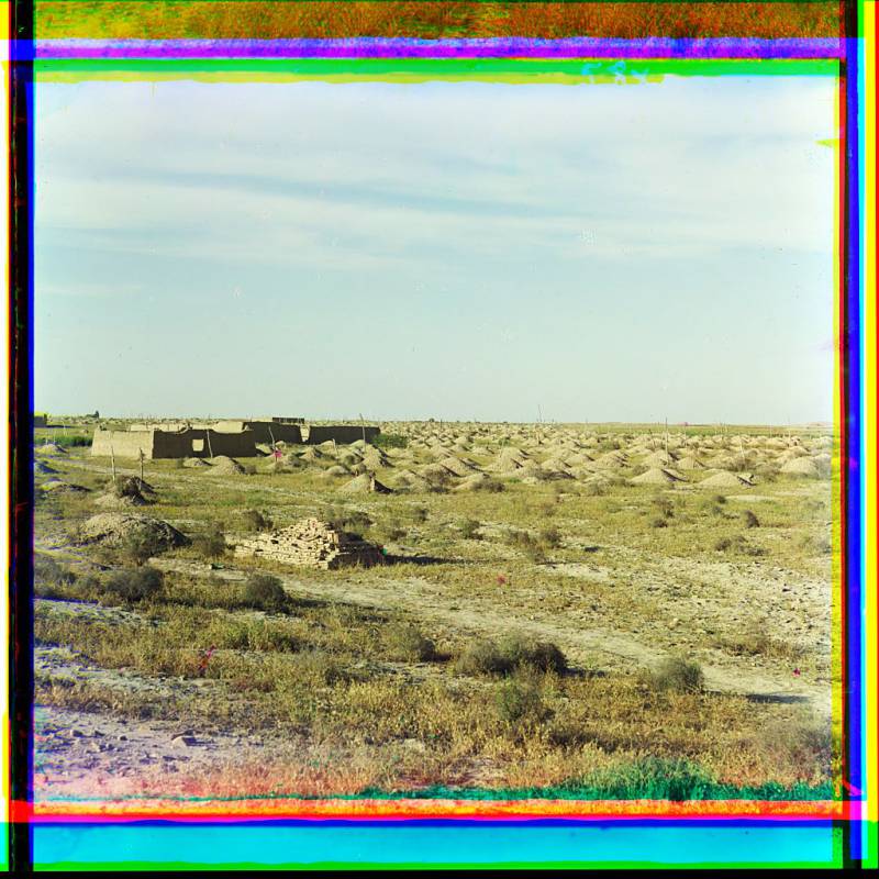 adobe_buildings_and_burial_mounds_in_desert_area.jpg
