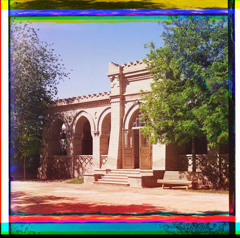 brick_building_with_arched_entrance_and_arcade.jpg