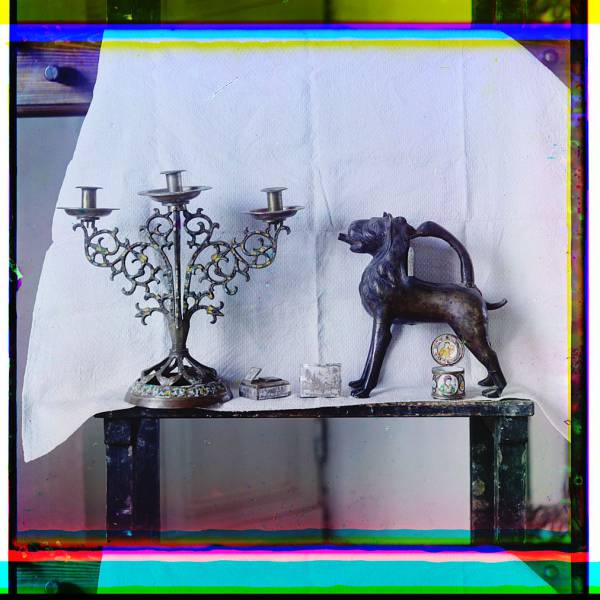 decorative_items_on_display_including_a_candleabra_boxes_and_a_carved_animal_sculpture.jpg