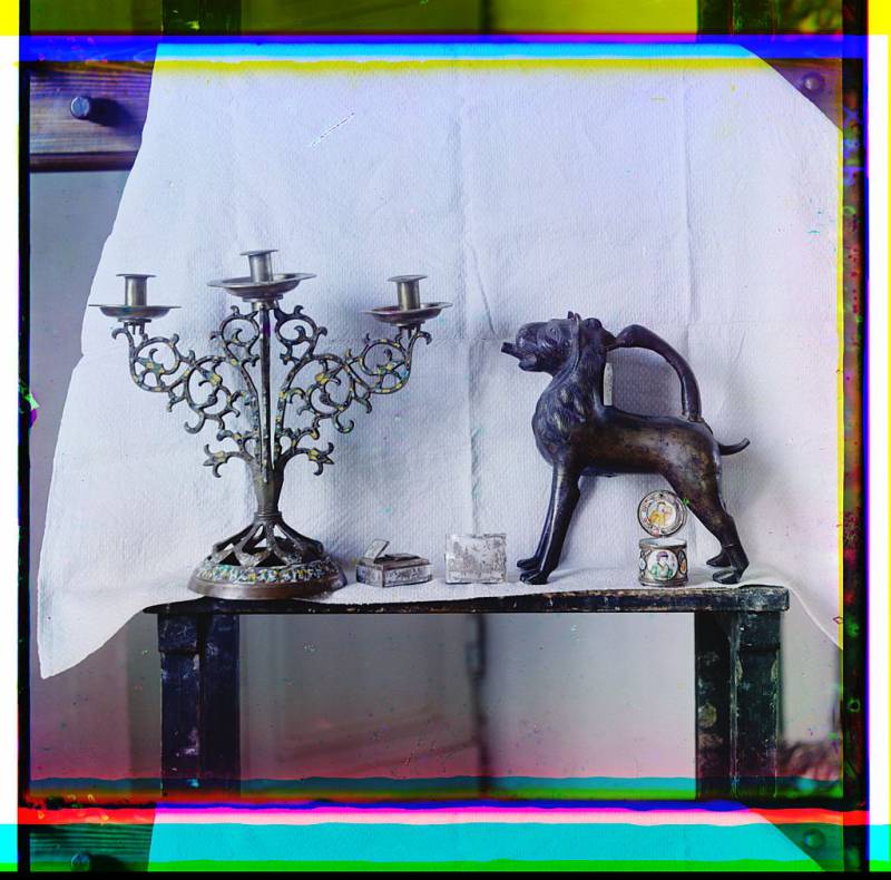 decorative_items_on_display_including_a_candleabra_boxes_and_a_carved_animal_sculpture.jpg