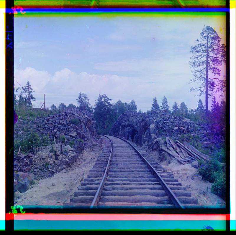 man_standing_beside_railroad_tracks.jpg