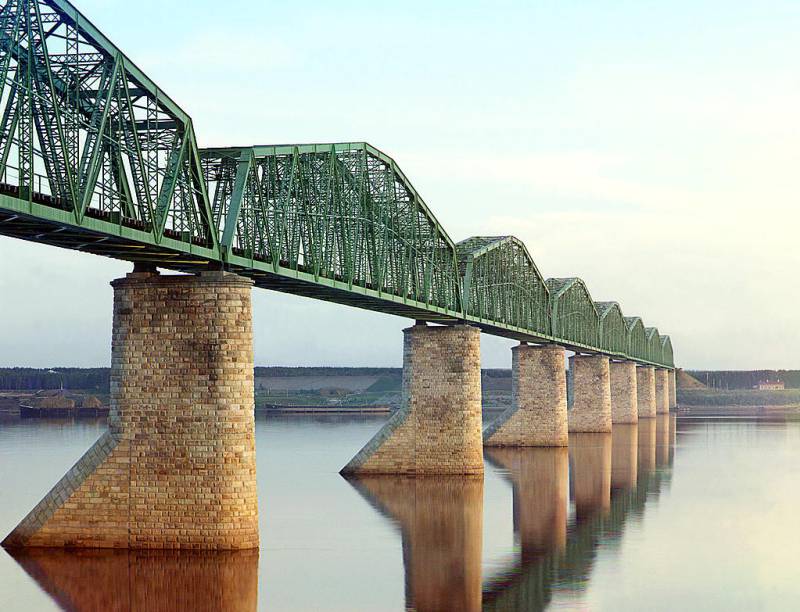 trans-siberian_railway_metal_truss_bridge_on_stone_piers_over_the_kama_river_near_perm_ural_mountains_region.jpg